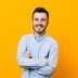 Portrait,Of,Handsome,Young,Guy,Standing,Against,Yellow,Wall.
